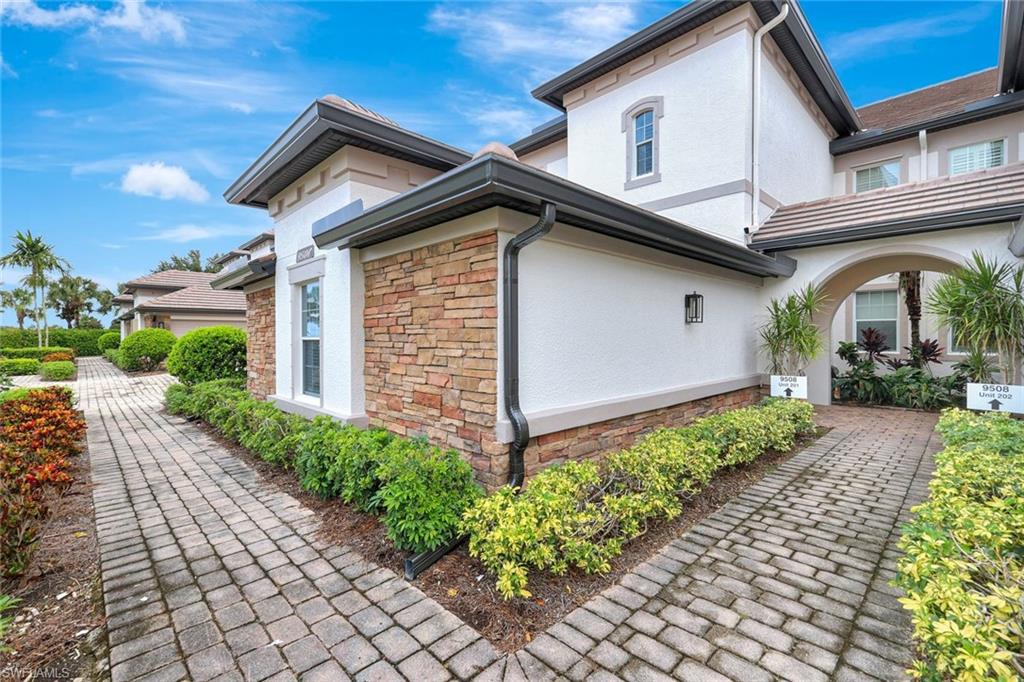 View of home's exterior featuring stone siding and stucco siding