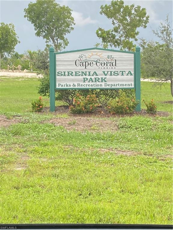 Community sign featuring a yard