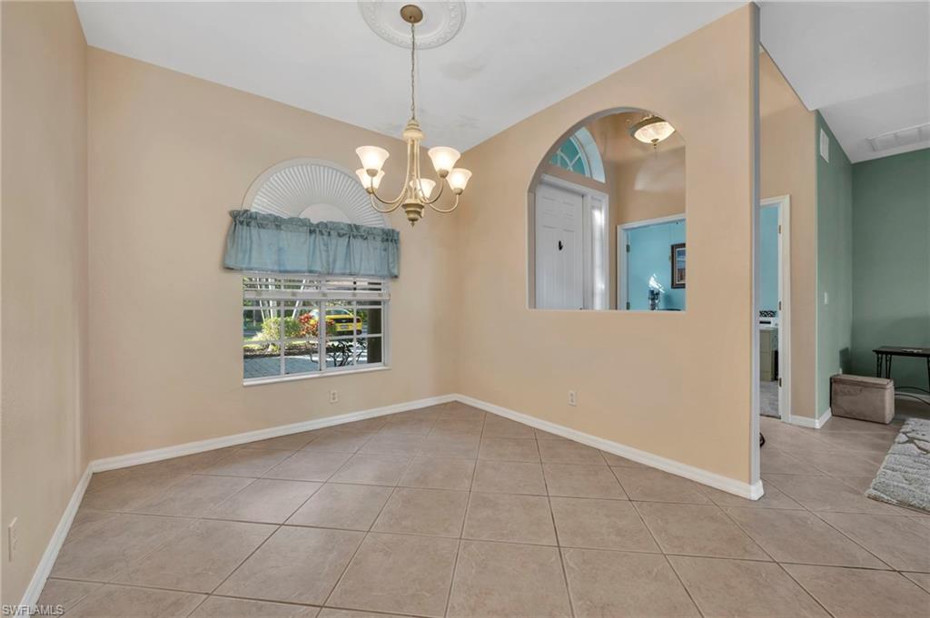 Dining room featuring a chandelier and light tile patterned floors
