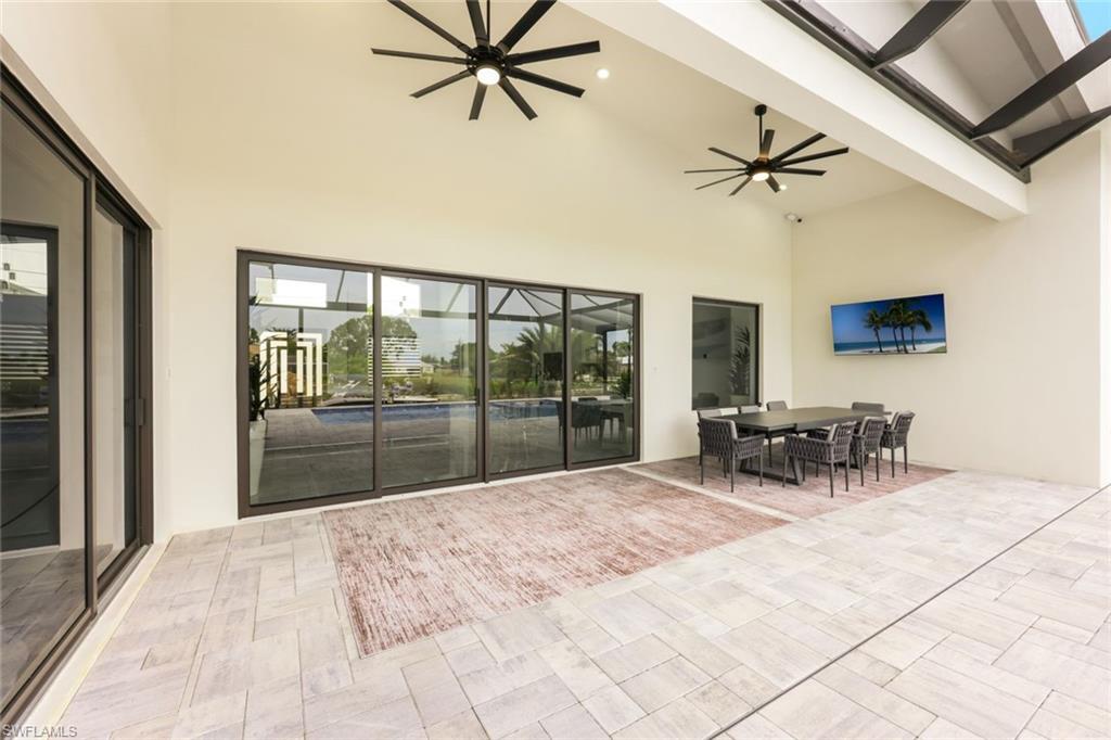 View of patio featuring a ceiling fan and outdoor dining area