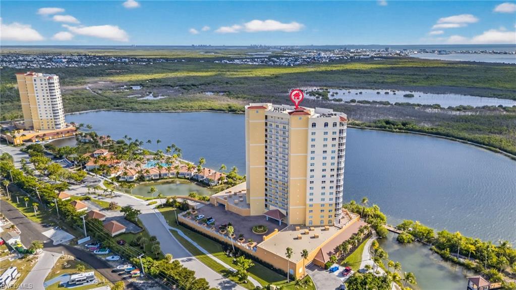 Bird's eye view of a large body of water and apartment complex