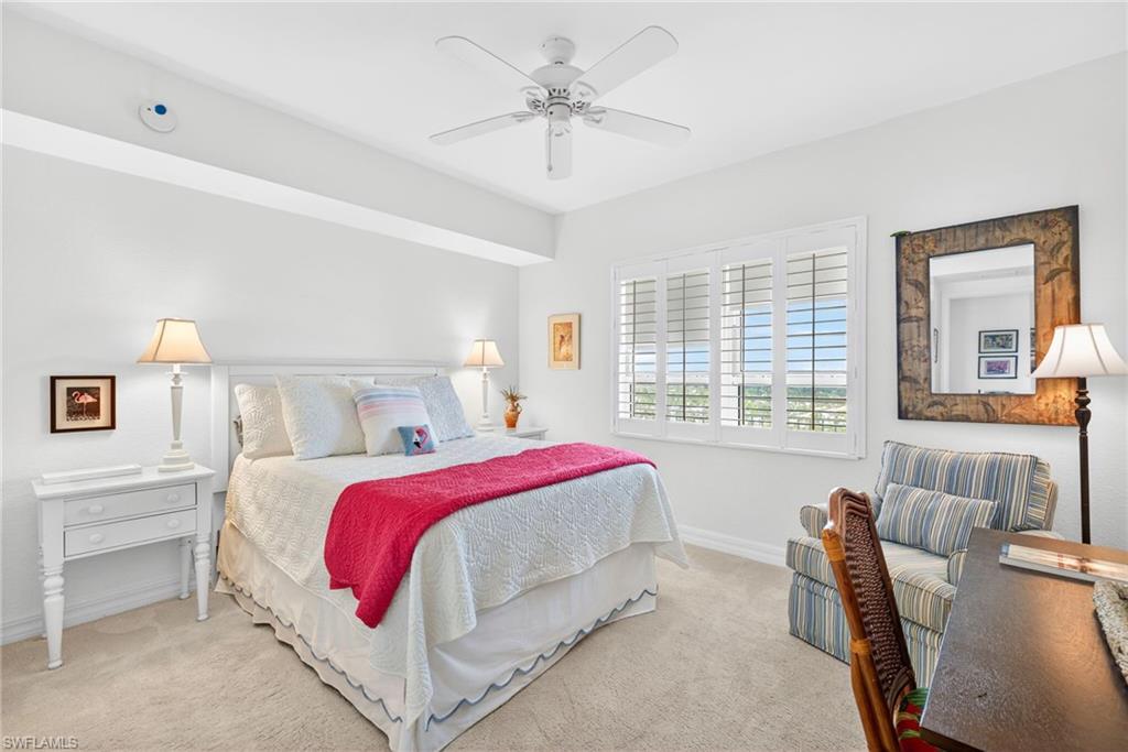 Bedroom featuring a ceiling fan and carpet flooring