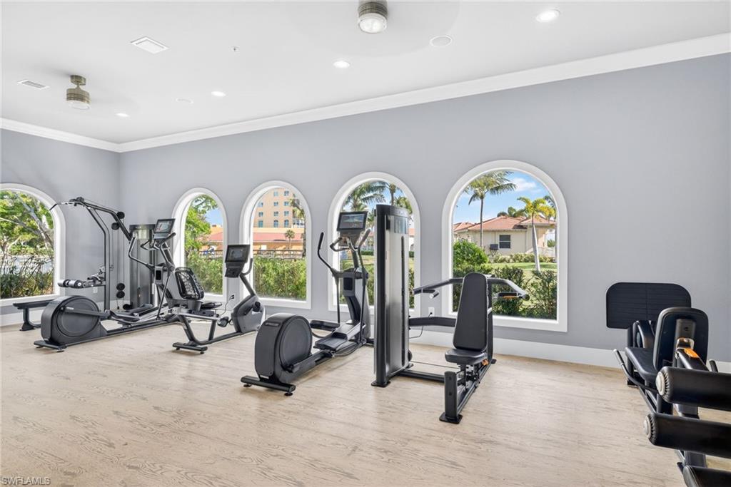 Workout room featuring crown molding and recessed lighting