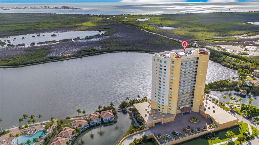 Aerial view of a large body of water and apartment complex