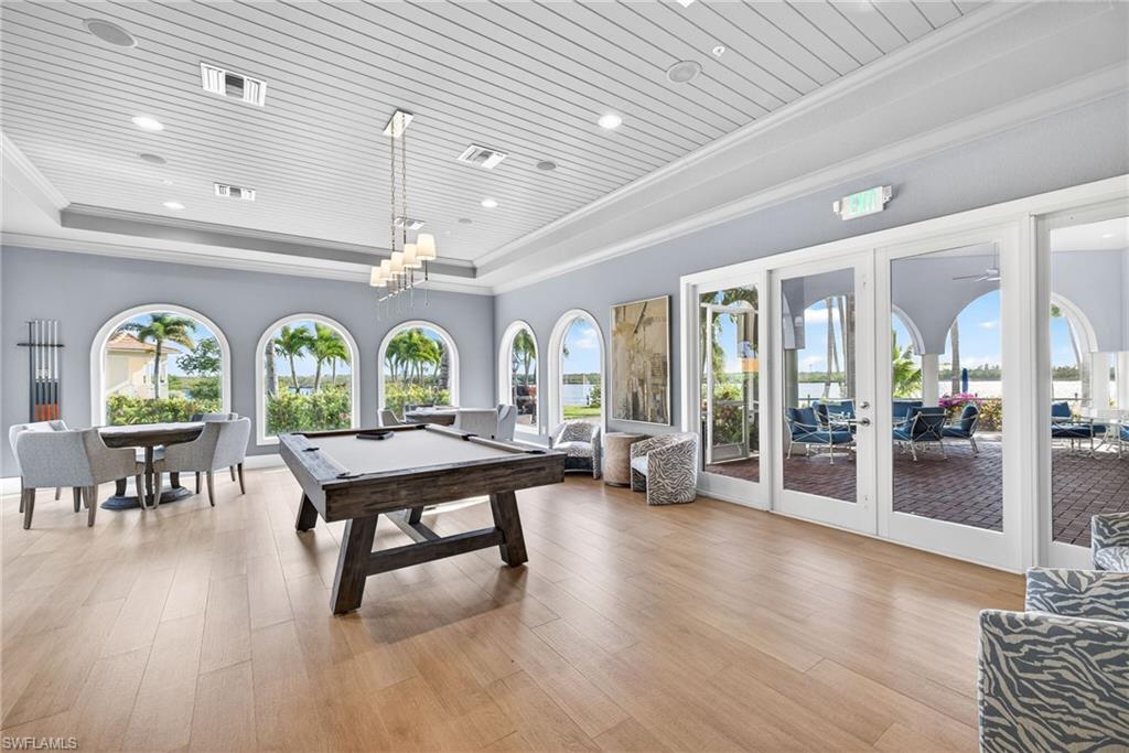 Rec room with french doors, crown molding, billiards, and wood ceiling