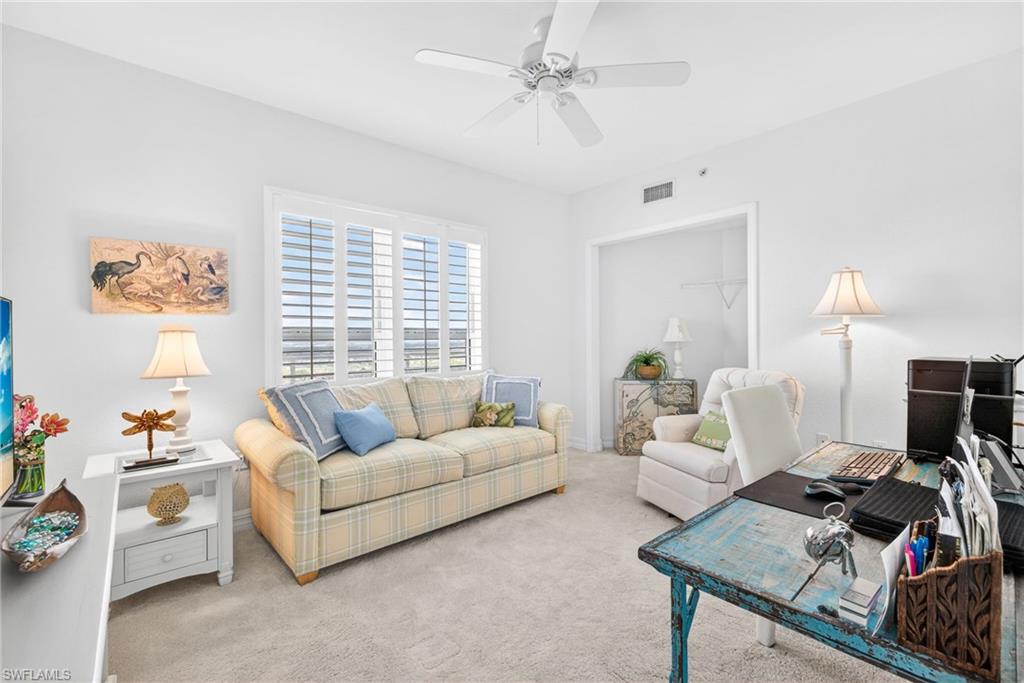 Office area featuring carpet flooring and ceiling fan