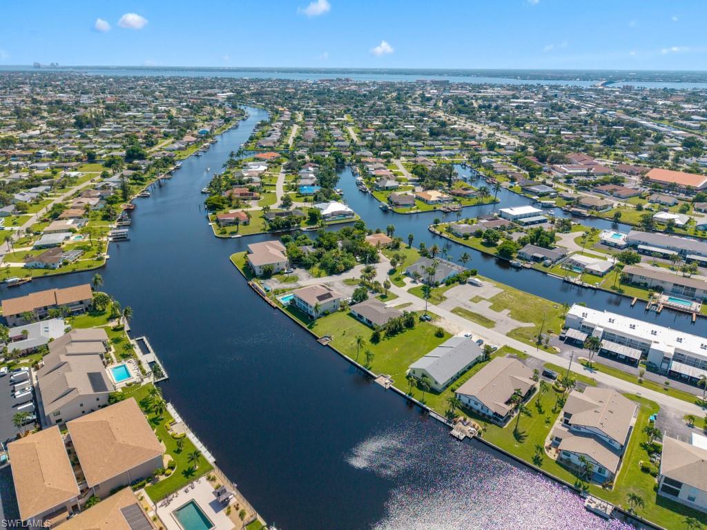 Aerial view of residential area with a large body of water
