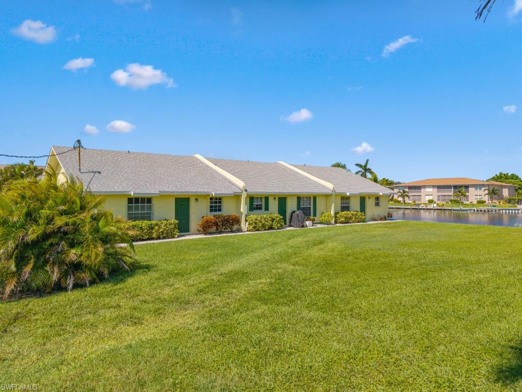 View of front of property with a front lawn