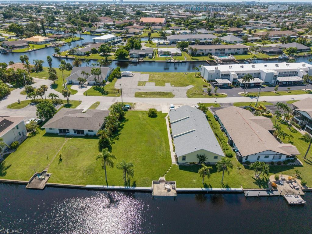 Aerial view of residential area with a large body of water