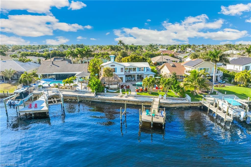 Dock featuring a residential view, a water view, and boat lift
