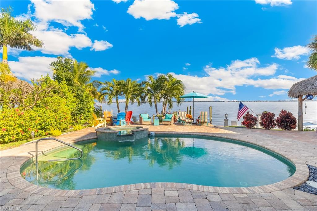 View of pool featuring a pool with connected hot tub and a patio area