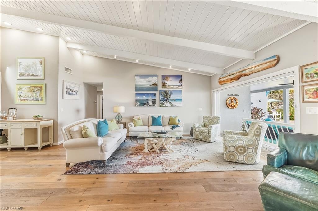 Living area featuring light wood-style floors and wood ceiling