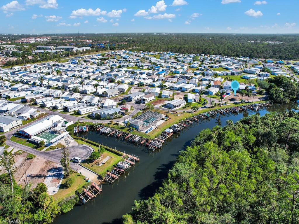 Aerial overview of property's location with nearby suburban area and a large body of water