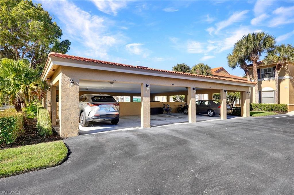 View of covered parking lot (one assigned space)