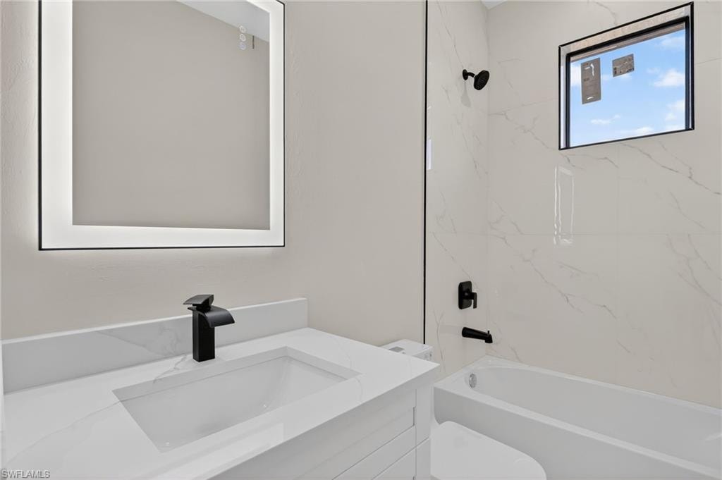 Guest bathroom with linin shelving storage area