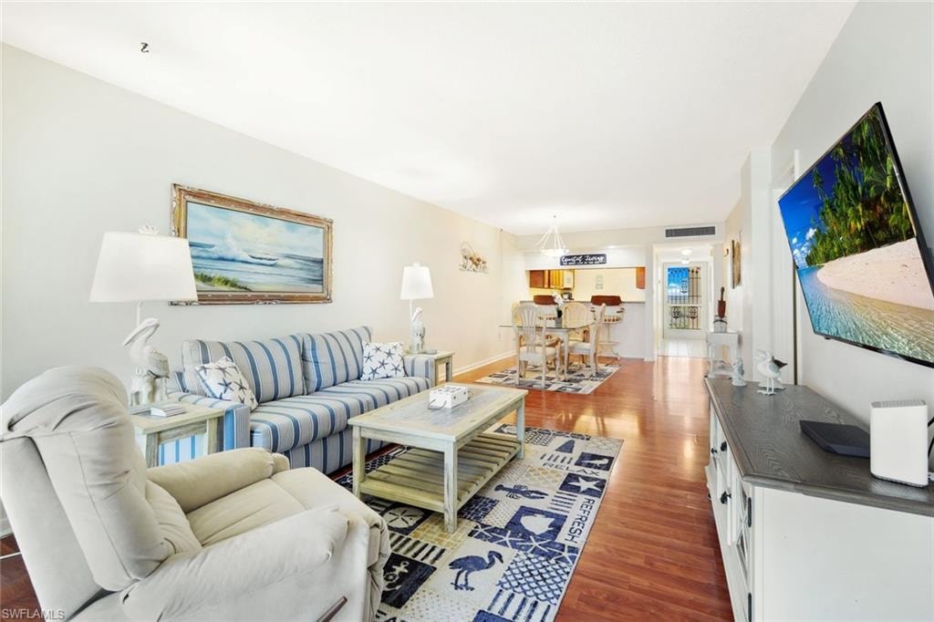 Living room featuring wood finished floors and baseboards
