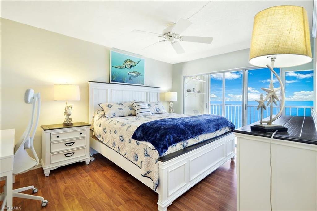 Bedroom featuring dark wood-type flooring and a ceiling fan