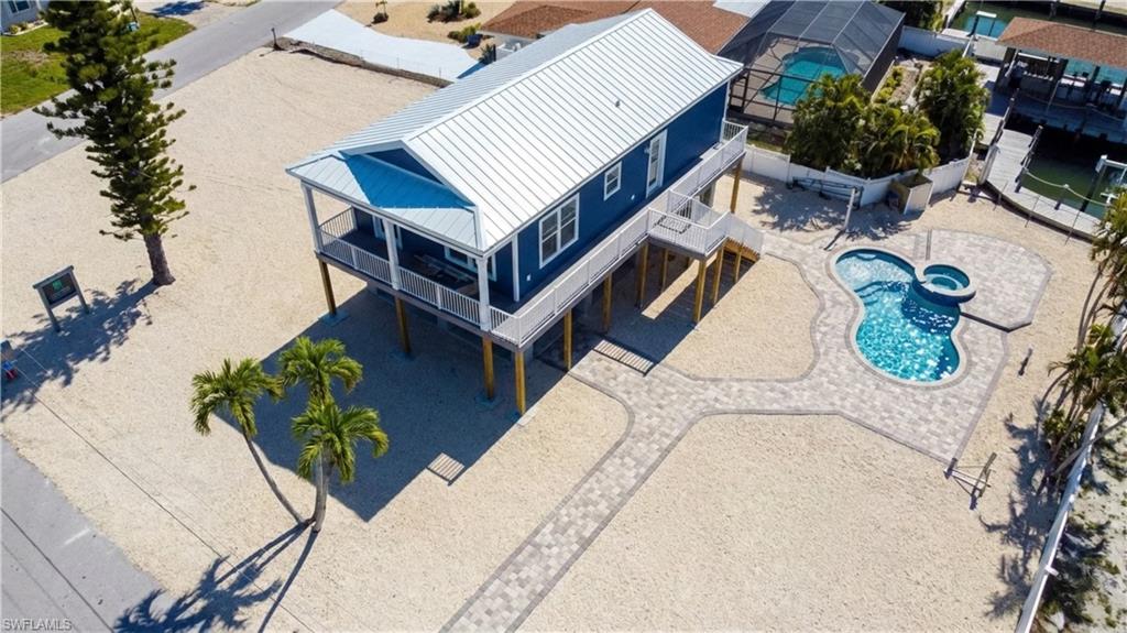 Aerial view of a pool area - -VIRTUALLY EDITED