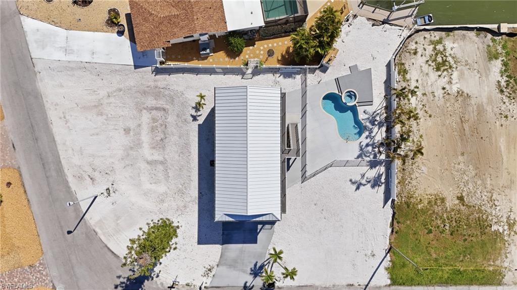 Modern single-story residence featuring a light-colored metal roof - Virtually Edited Image
