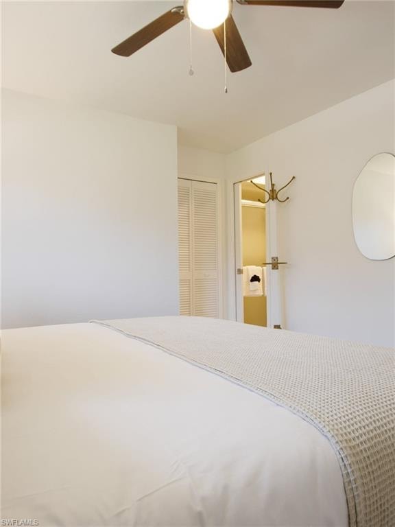 Bedroom featuring a closet and a ceiling fan