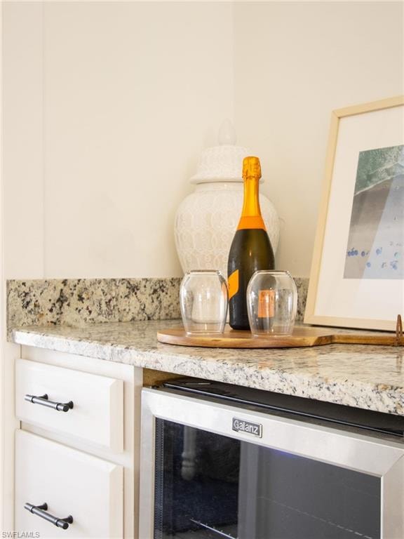 Detailed view of beverage cooler and light stone counters