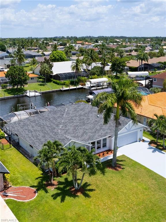 Aerial perspective of suburban area with a nearby body of water
