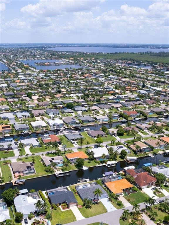 View of property location with a large body of water and nearby suburban area