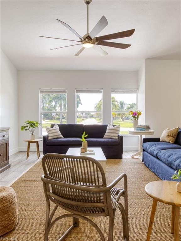 Living area with healthy amount of natural light and ceiling fan