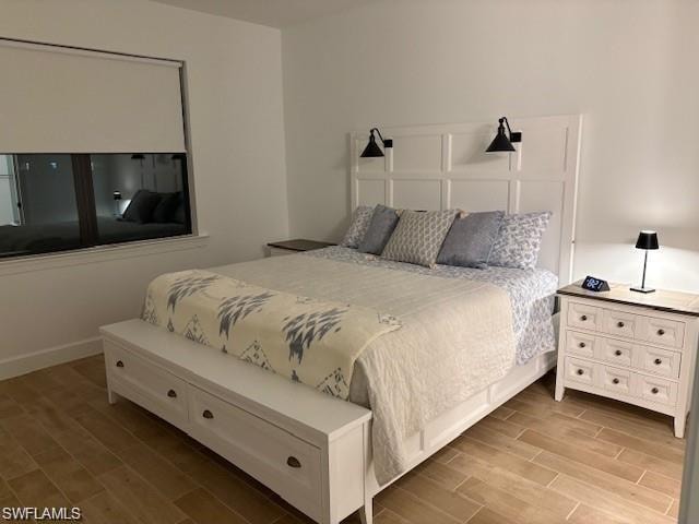 Bedroom featuring wood tiled floors