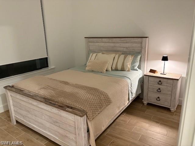 Bedroom featuring wood finish floors