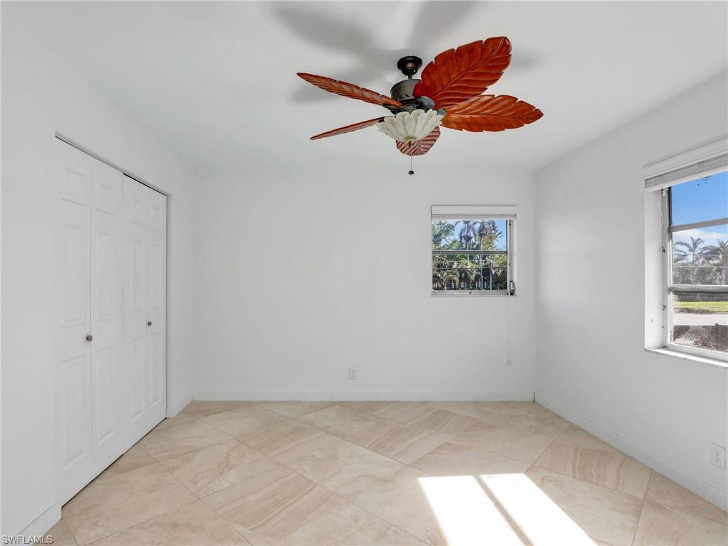 Unfurnished bedroom featuring a closet and a ceiling fan