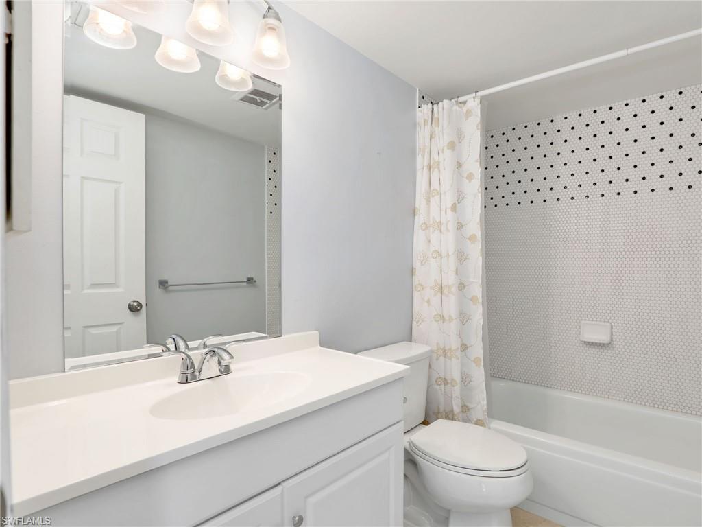 Full bath featuring vanity and shower / bath combo