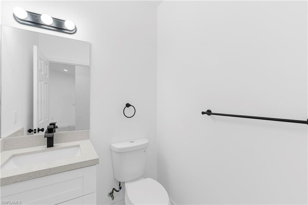 Bathroom with vanity and toilet