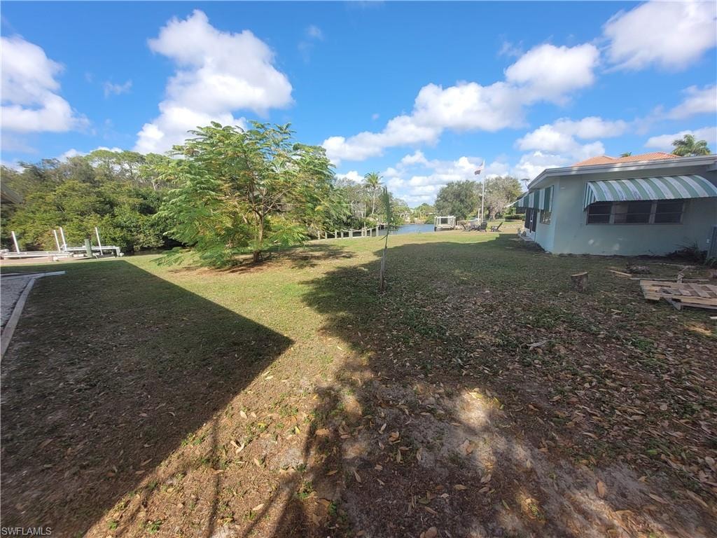 View of grassy yard featuring a water view