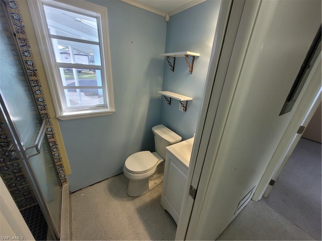 Full bathroom featuring vanity and a stall shower