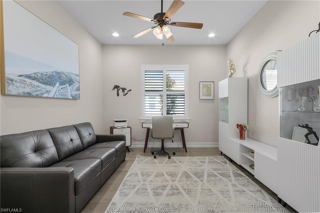 Home office featuring tile floors, a ceiling fan, and recessed lighting