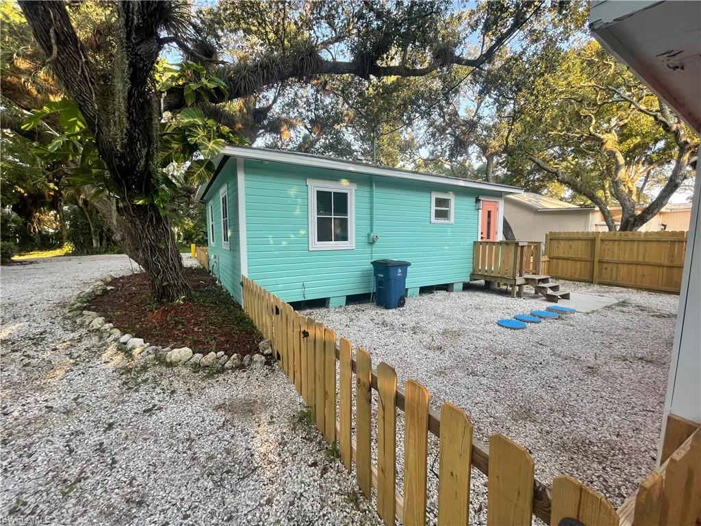 Back of house featuring a fenced backyard