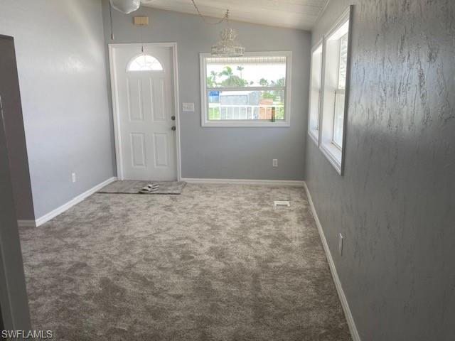 carpet floors and lofted ceiling  Living room