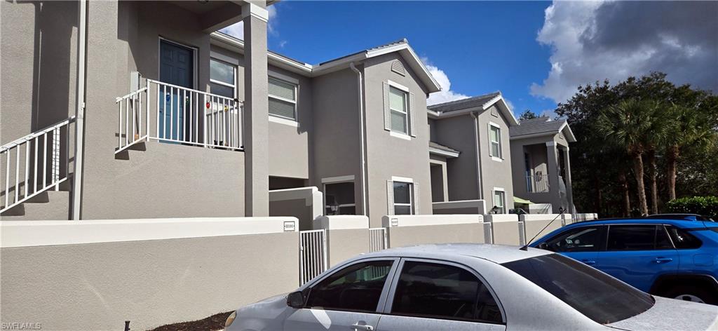 View of side of property featuring stucco siding.