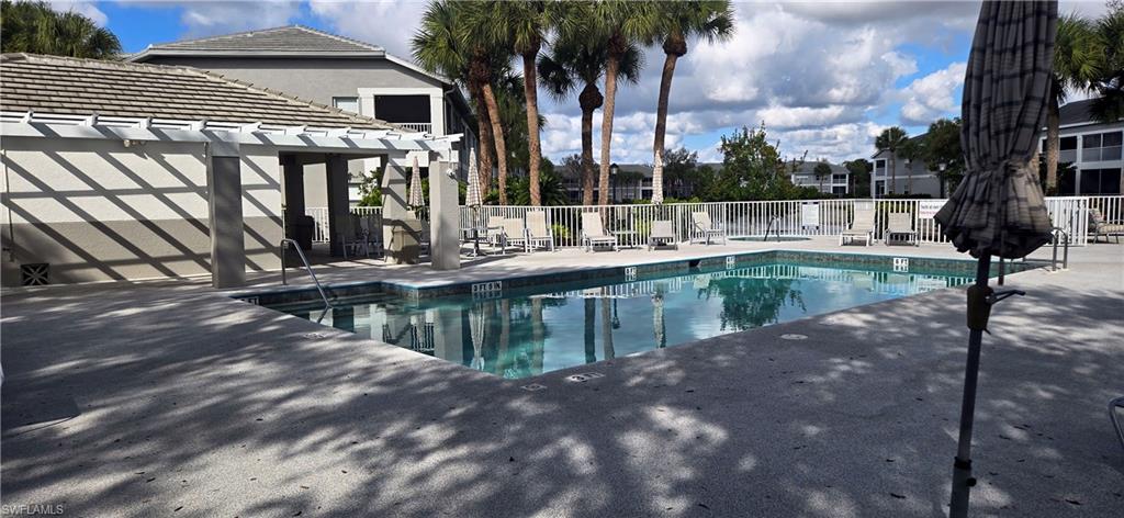 Community pool with a patio area