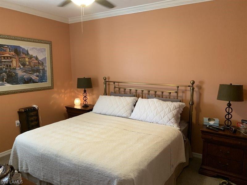 Bedroom featuring crown molding and ceiling fan