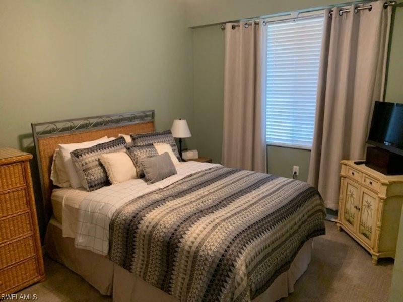 Bedroom with carpet
