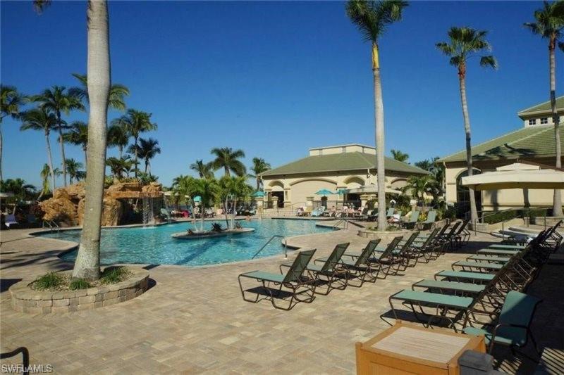Community pool with a patio area and a gazebo