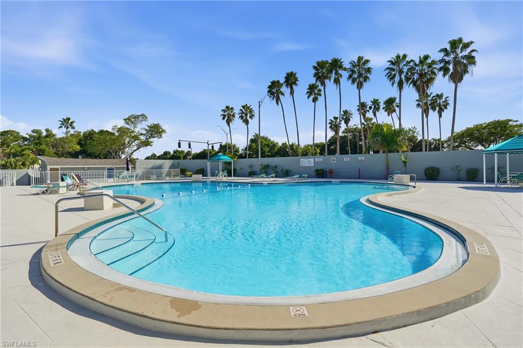 Community pool featuring a patio