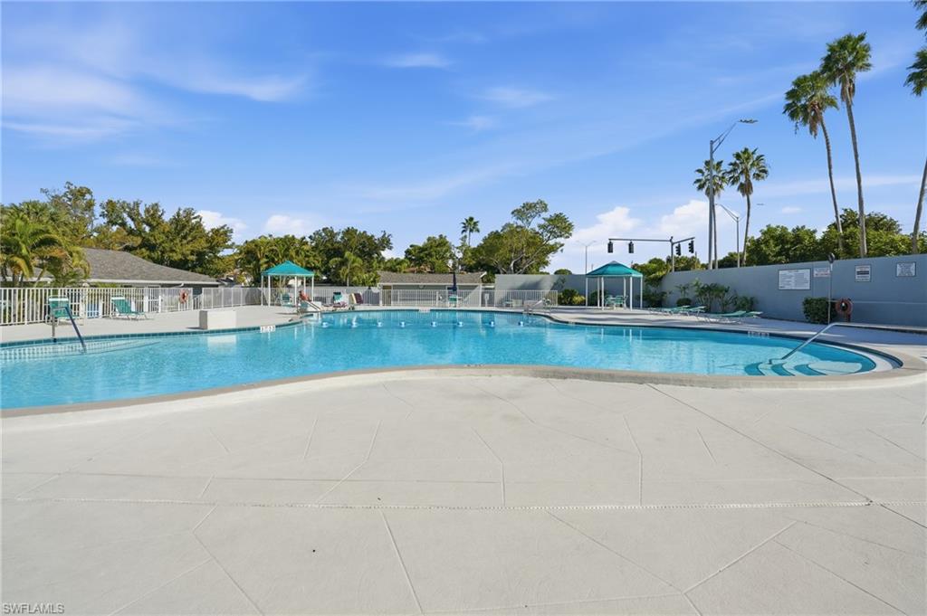 Community pool featuring a patio