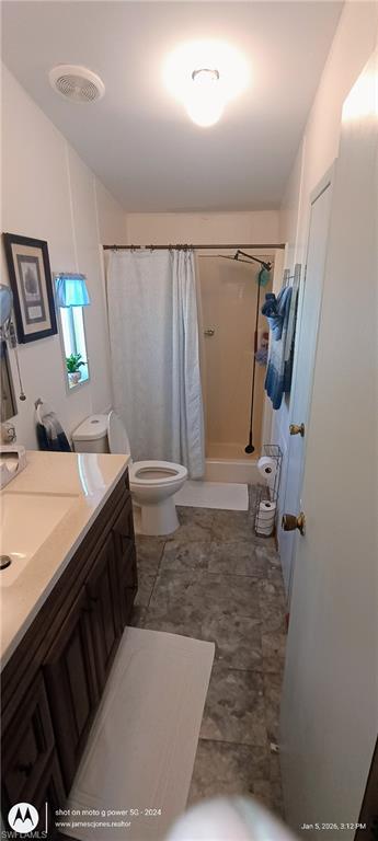 Bathroom with vanity and a shower stall