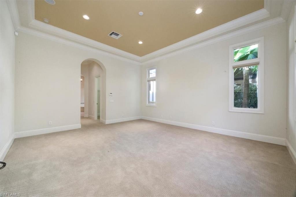 Owner's suite with crown molding and tray ceiling