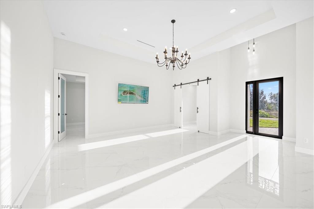 Walk in closet with light marble finish floors