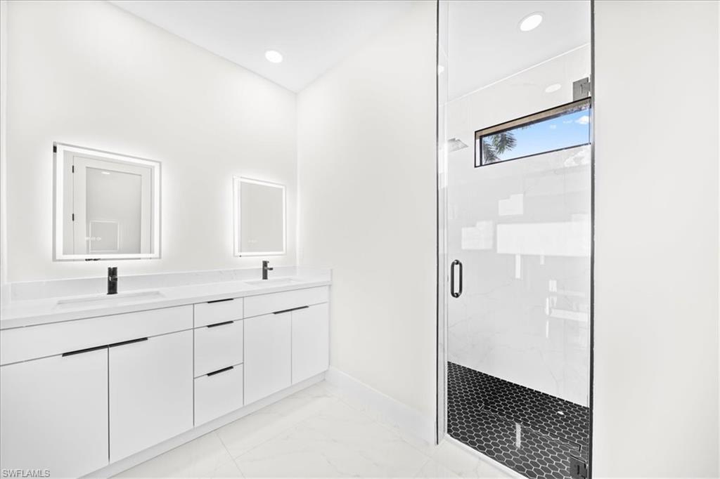 Empty room with recessed lighting, a ceiling fan, and light marble finish flooring