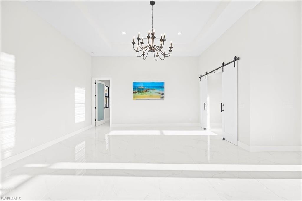 Laundry room featuring light marble finish floors, cabinet space, hookup for an electric dryer, and washer hookup